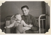 Unknown man holding Alex Grossman