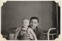 Unknown man holding Alex Grossman